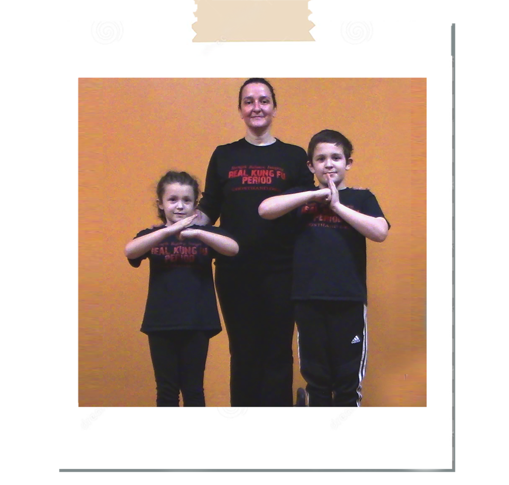 Assistant Instructor and 2 children showing their mutual respect with a traditional salute