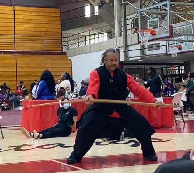 Practitioners demonstrating martial arts for fitness and health.