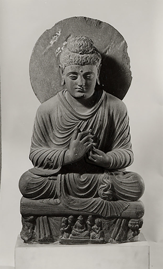 A large-scale image of the Buddha seated cross-legged in a yogic posture On display at the V&A South Kensington Buddhism Room 47f
