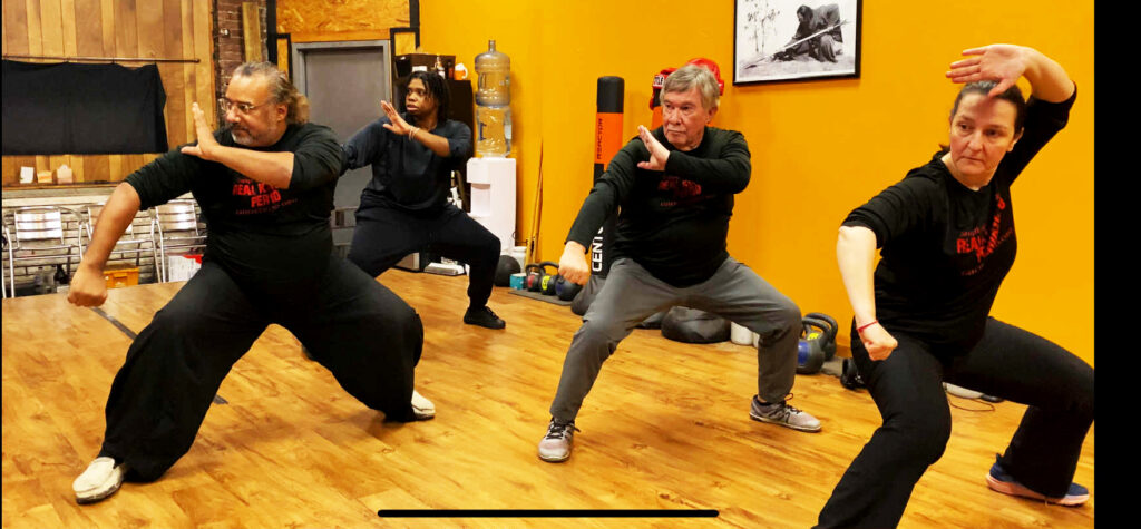 Marc Black teaching Traditional Chinese Martial Arts and combat class in Pittsburgh PA with adults and seniors practicing Tai Chi and Kung Fu.