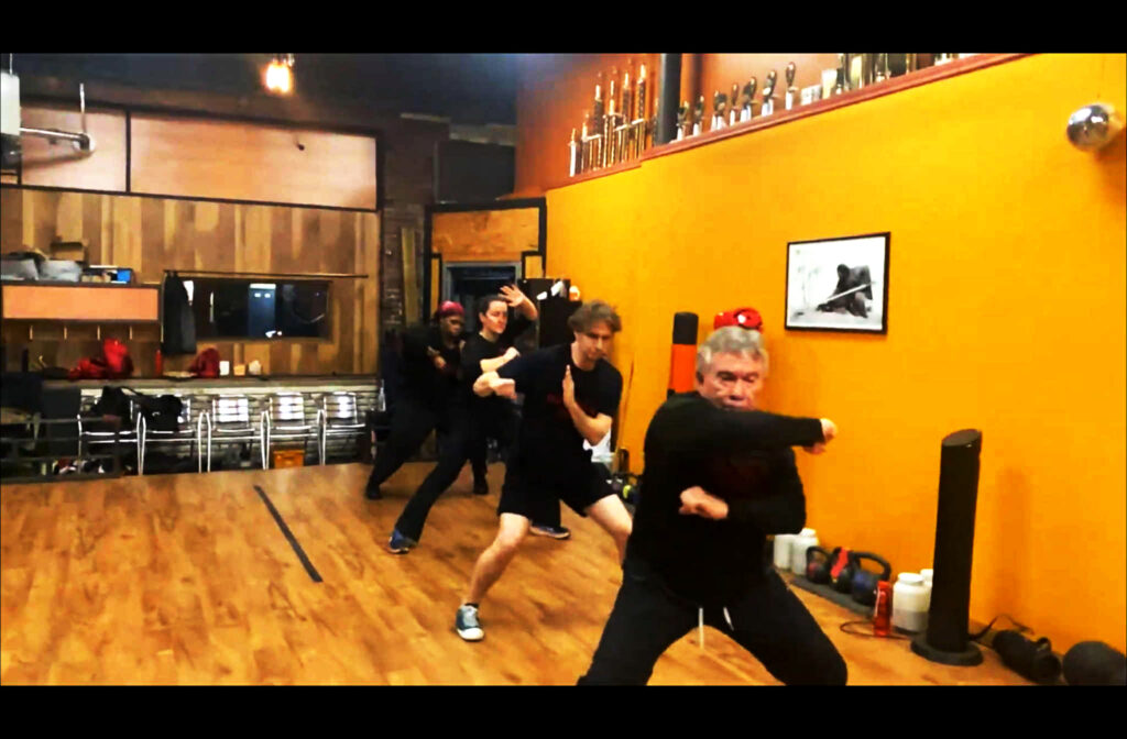 Adults practicing traditional Chinese Kung Fu drills at martial arts school in Pittsburgh