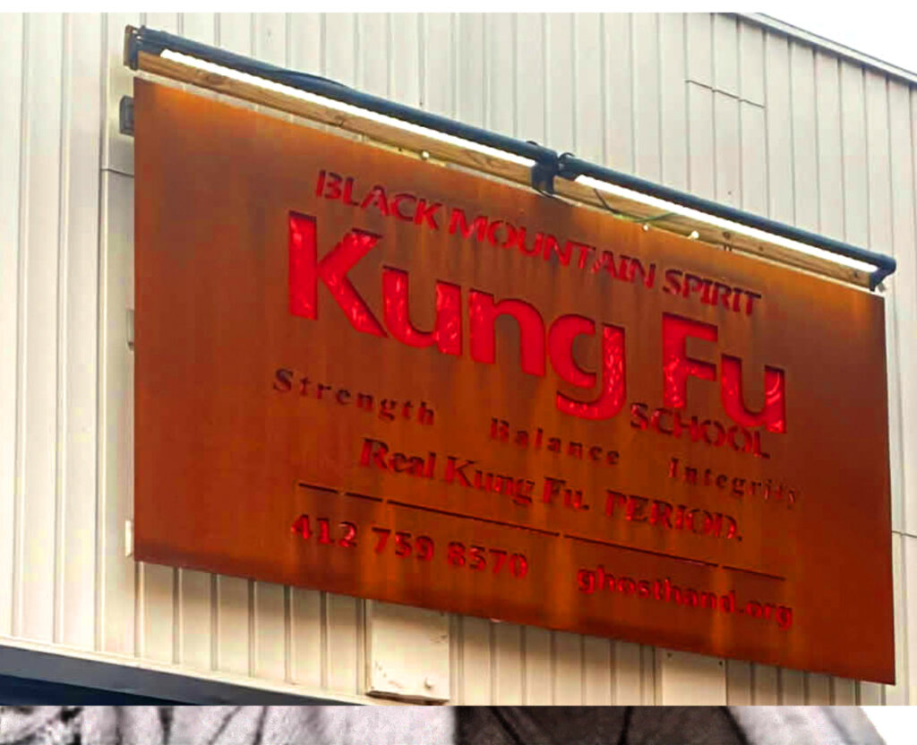 Entrance of Black Mountain Spirit martial arts school Pittsburgh featuring Real Kung Fu Period slogan.